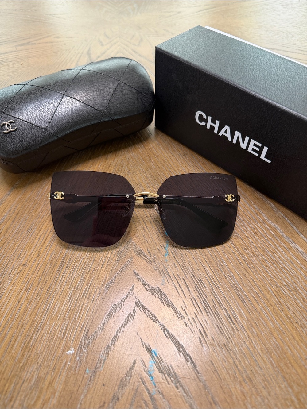 CHANEL Square Rimless Sunglasses in Black and Gold